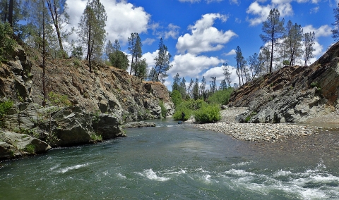 a river flowing through mountains