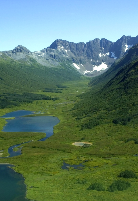 An aerial view of the mountains and green valleys of Togiak National Wildlife Refuge 