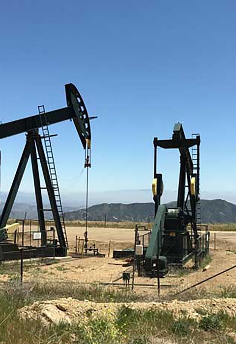 Three large black oil drills