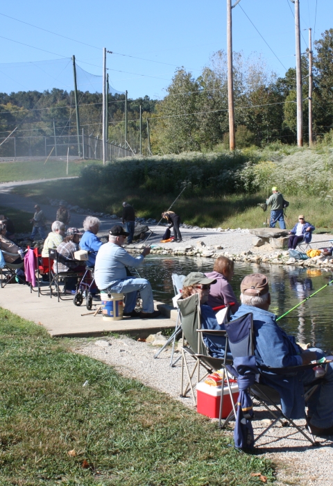 Hatchery Creek lined with anglers fishing at Wolf Creek National Fish Hatchery
