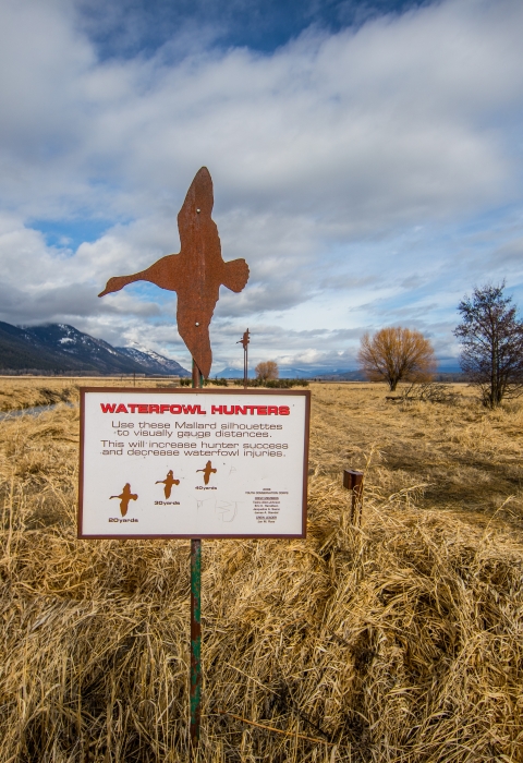 A sign denotes proper shooting distance for hunters