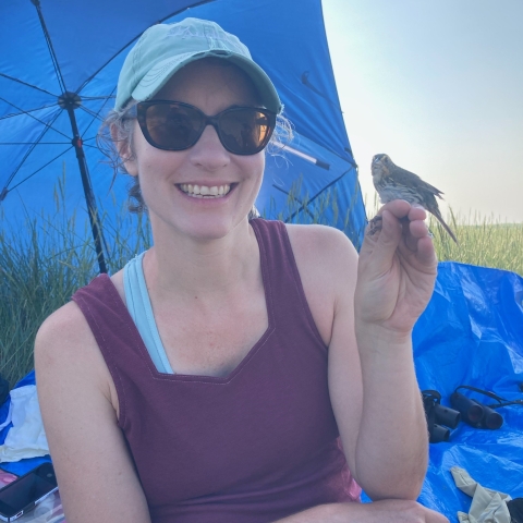 Aimee Weldon holding Saltmarsh Sparrow