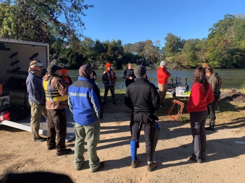 Group photo discussing safety protocols.