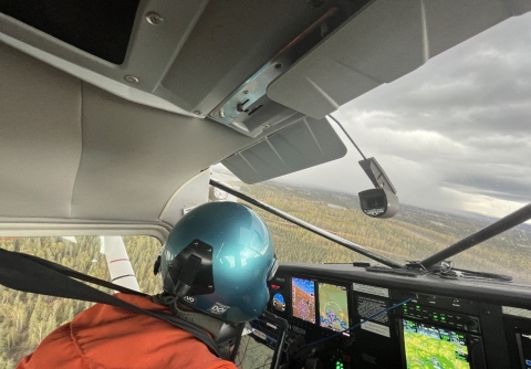 pilot flying a plane