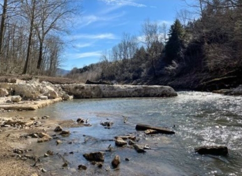 Three images of the dam. 1. Full dam on a rocky stream, 2. Partial dam, part of the structure is gone, 3. open river bed and earthen streambanks held in place with canvas and rock.