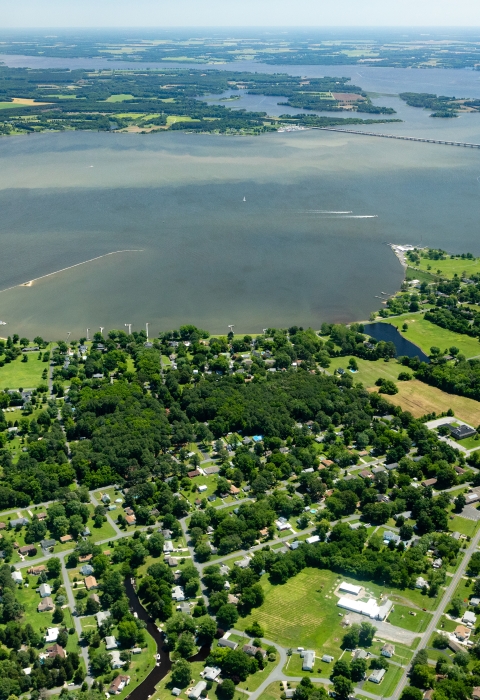 Aerial view of a river flowing past a town