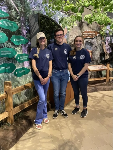 Three volunteers standing together