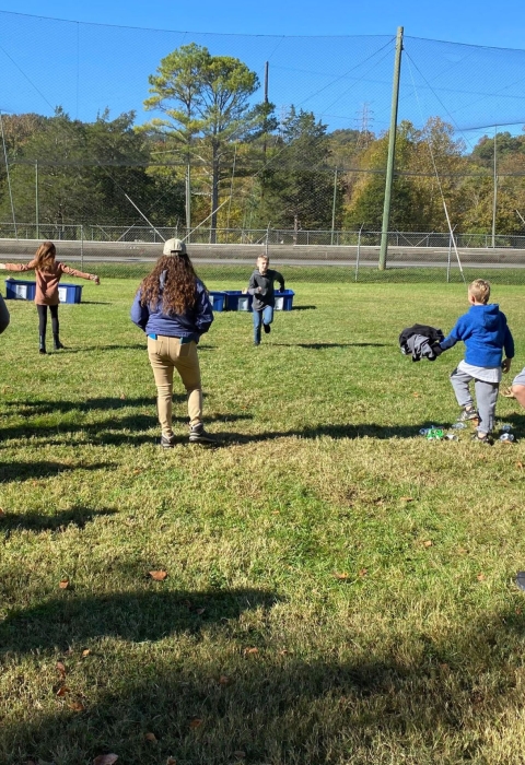 Kids playin in a field 