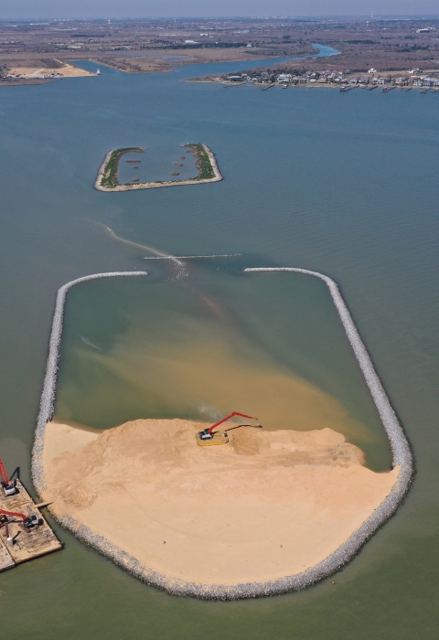 Construction of Dickinson Bay Island 2 with Dickinson Bay Island 1 in the background.