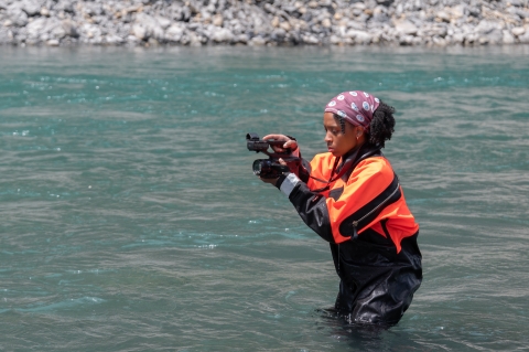 USFWS digital media intern, Typhanie Shepherd, capturing video footage of fiel