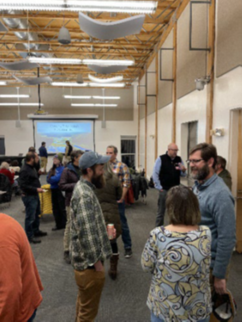 Community participants talking at "Meet Your Marsh!" meeting.