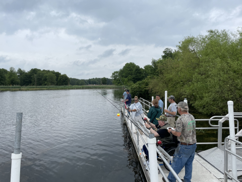 Veterans fishing off the fishing pier during the Veterans' Fishing Derby at Wallkill River National Wildlife Refuge